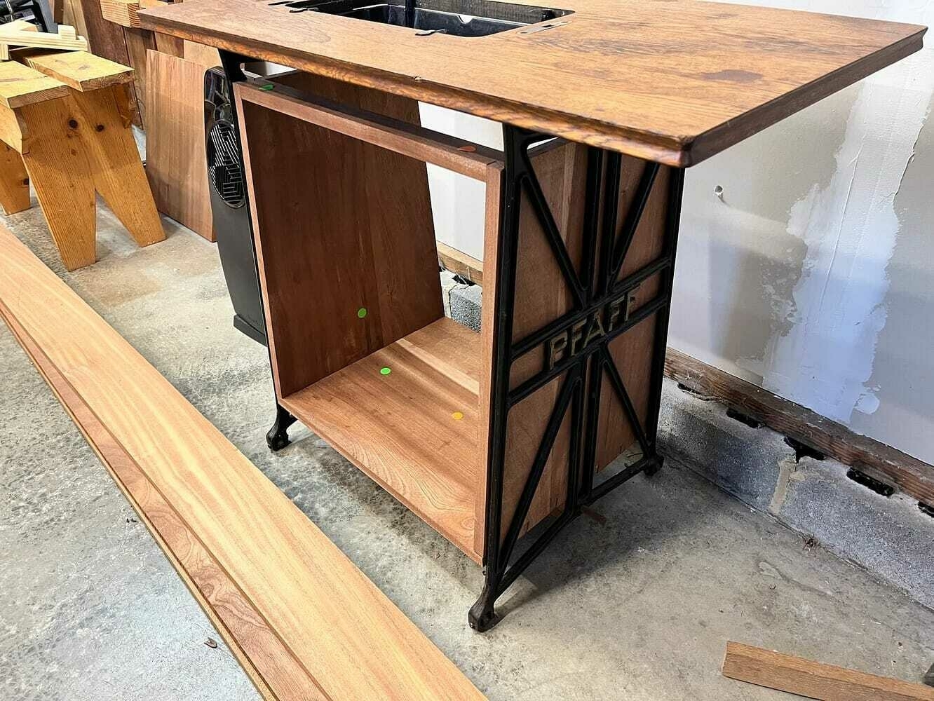 The dry fit cabinet placed in the sewing machine table base.