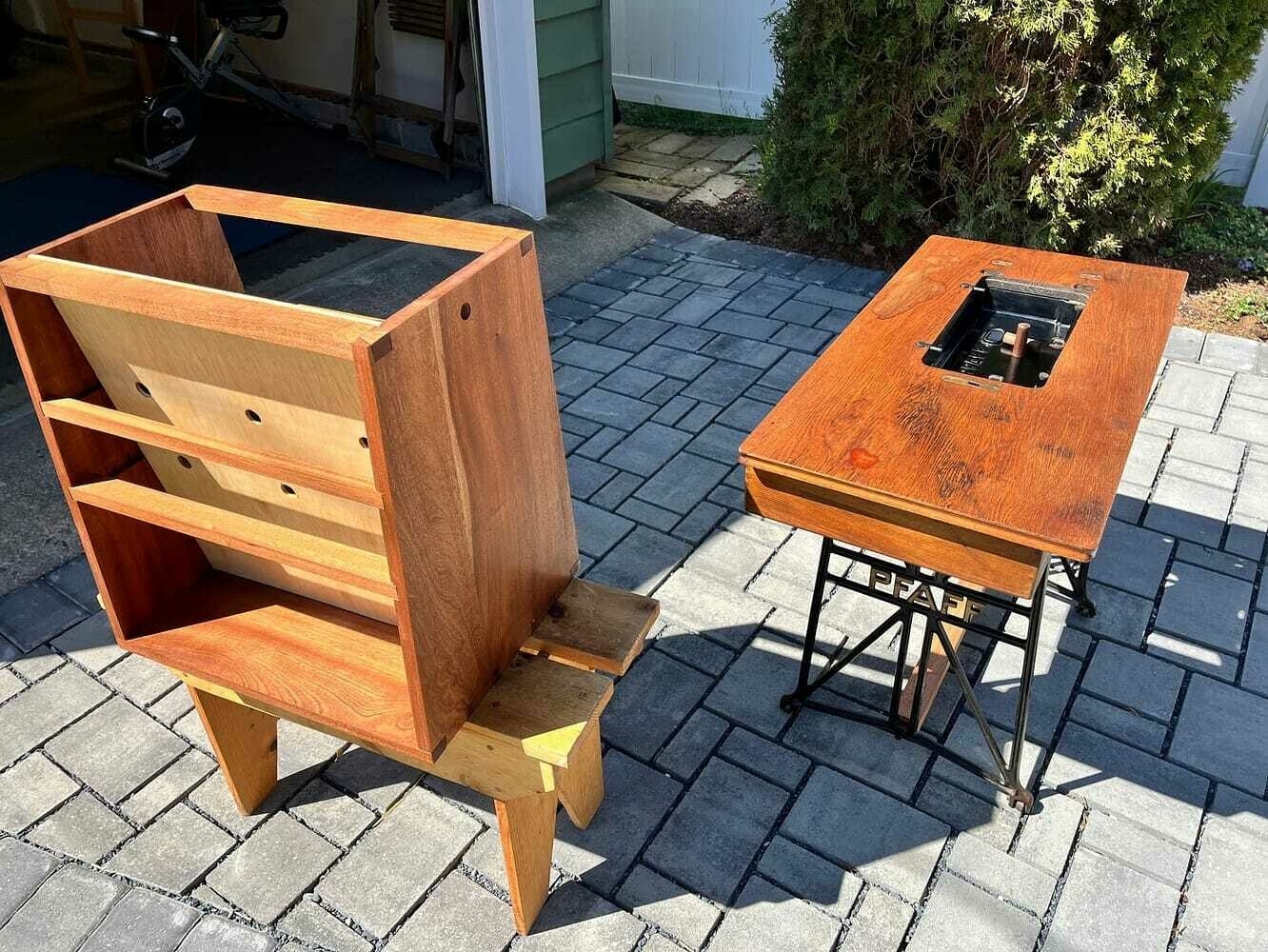 A view of the back of the cabinet, showing the angled plywood panel with cable holes.